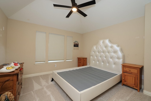 6 Lovenote Ct, The Woodlands, TX 77382 - bedroom with light colored carpet, baseboards, vaulted ceiling, and ceiling fan