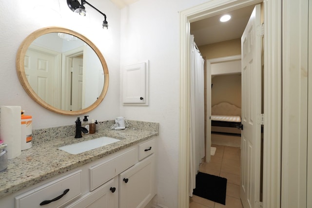 6 Lovenote Ct, The Woodlands, TX 77382 - bathroom featuring vanity and tile patterned floors