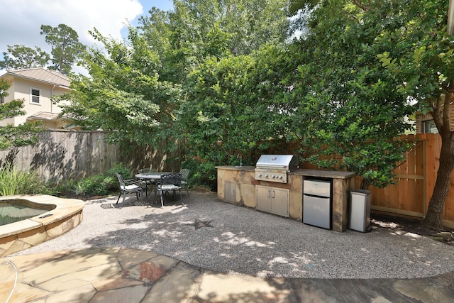 6 Lovenote Ct, The Woodlands, TX 77382 - fenced backyard with a patio and outdoor dining area