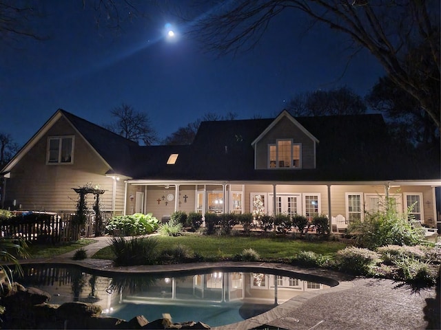 5318 E Plantation Oaks Dr, Arcola, TX 77583 - view of back of house at night