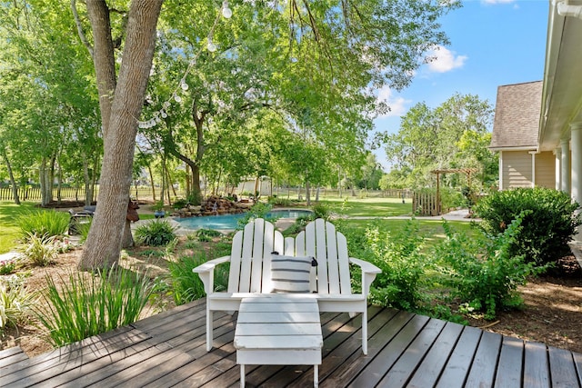 5318 E Plantation Oaks Dr, Arcola, TX 77583 - deck featuring an outdoor pool and view of wooded area