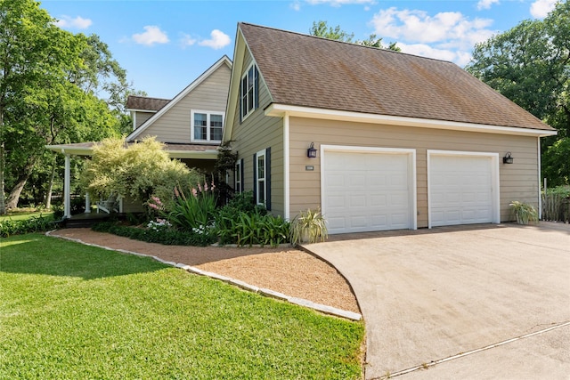 5318 E Plantation Oaks Dr, Arcola, TX 77583 - view of side of home featuring a garage, a yard, and roof with shingles