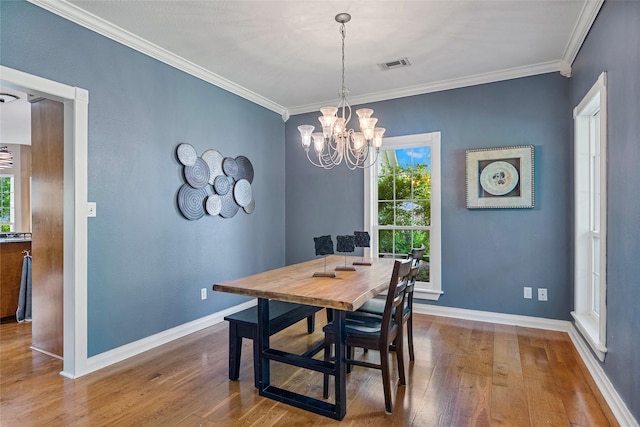 5318 E Plantation Oaks Dr, Arcola, TX 77583 - dining space featuring wood finished floors, baseboards, ornamental molding, and a chandelier