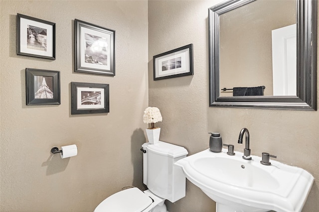 5318 E Plantation Oaks Dr, Arcola, TX 77583 - half bathroom with toilet and a sink