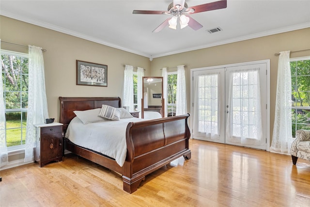 5318 E Plantation Oaks Dr, Arcola, TX 77583 - bedroom with access to exterior, french doors, light wood-style flooring, ornamental molding, and ceiling fan