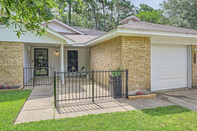 3106 Village Springs Ct, Houston, TX 77339 - view of front facade featuring brick siding, a gate, an attached garage, and a shingled roof