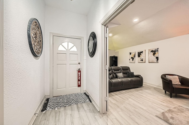 3106 Village Springs Ct, Houston, TX 77339 - entrance foyer featuring light wood-style floors, baseboards, and a textured wall