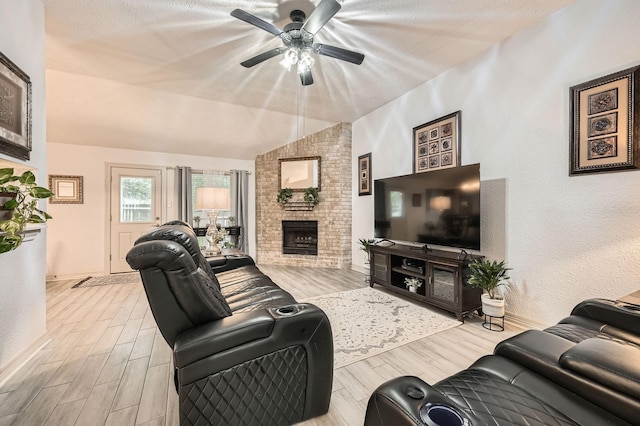 3106 Village Springs Ct, Houston, TX 77339 - living room featuring ceiling fan, wood finished floors, lofted ceiling, a fireplace, and baseboards