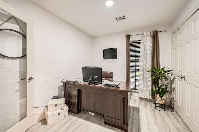 3106 Village Springs Ct, Houston, TX 77339 - office area with light wood-style floors and a textured wall