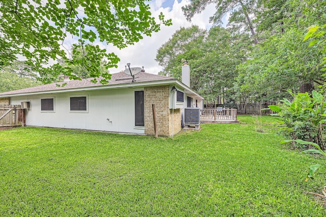 3106 Village Springs Ct, Houston, TX 77339 - rear view of property with a chimney, cooling unit, and a wooden deck