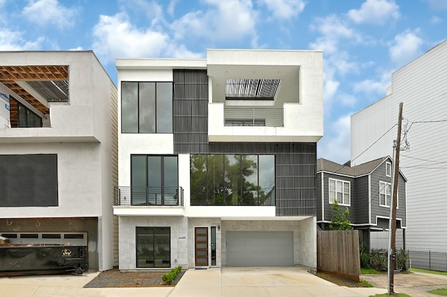 1505 Stuart St, Houston, TX 77004 - view of front of property with concrete driveway, a garage, and stucco siding