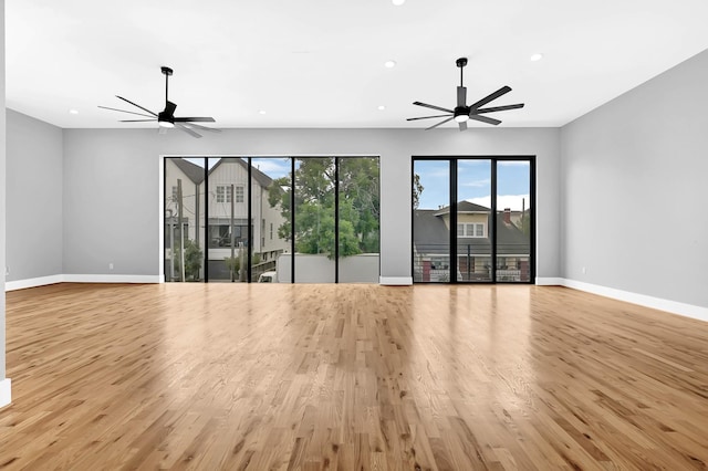 1505 Stuart St, Houston, TX 77004 - unfurnished living room featuring ceiling fan, light wood finished floors, baseboards, and recessed lighting