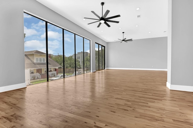1505 Stuart St, Houston, TX 77004 - unfurnished room featuring ceiling fan, baseboards, wood finished floors, and recessed lighting