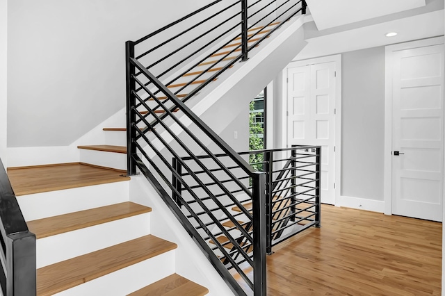 1505 Stuart St, Houston, TX 77004 - staircase featuring wood finished floors, baseboards, and recessed lighting