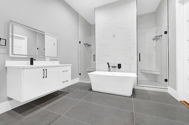 1505 Stuart St, Houston, TX 77004 - full bath featuring a marble finish shower, vanity, a soaking tub, and tile patterned flooring