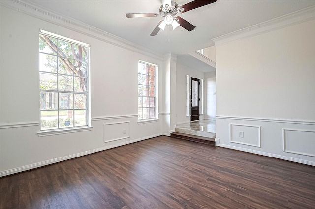 2130 Avenida La Quinta St, Houston, TX 77077 - spare room featuring ornamental molding, dark wood-style flooring, plenty of natural light, a ceiling fan, and wainscoting