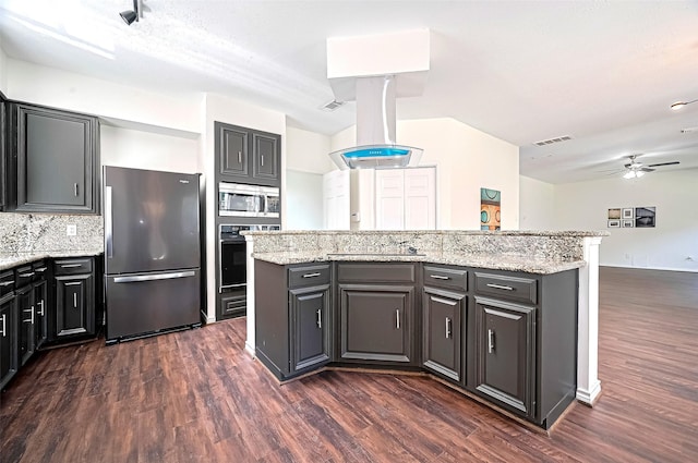 2130 Avenida La Quinta St, Houston, TX 77077 - kitchen with black appliances, dark wood-style floors, ceiling fan, a center island, and light stone countertops