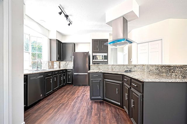 2130 Avenida La Quinta St, Houston, TX 77077 - kitchen featuring appliances with stainless steel finishes, island exhaust hood, a sink, dark wood-style floors, and light stone countertops