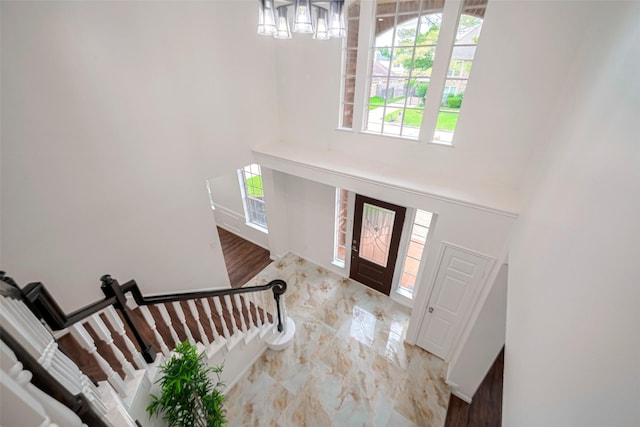 2130 Avenida La Quinta St, Houston, TX 77077 - entrance foyer featuring a chandelier, plenty of natural light, a towering ceiling, and marble finish flooring