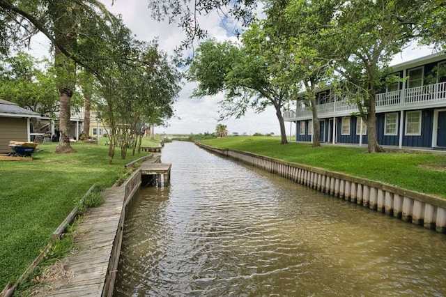 5216 County Road 469 Unit 10, Brazoria, TX 77422 - dock with a water view and a lawn