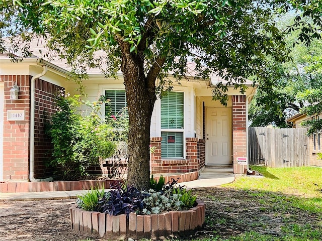 11410 Dahlia Dale Dr, Tomball, TX 77375 - doorway to property featuring brick siding