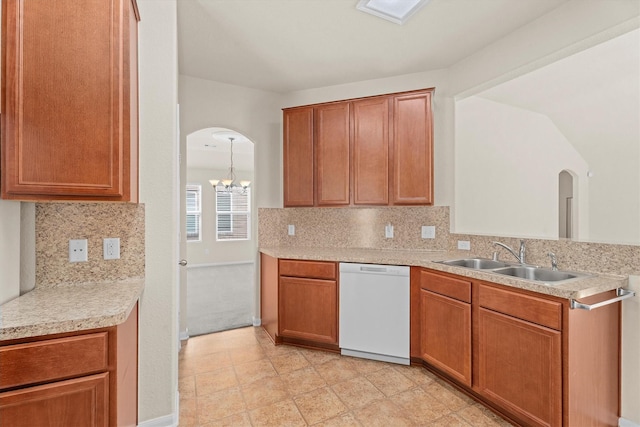 11410 Dahlia Dale Dr, Tomball, TX 77375 - kitchen featuring dishwasher, a sink, arched walkways, light countertops, and a chandelier