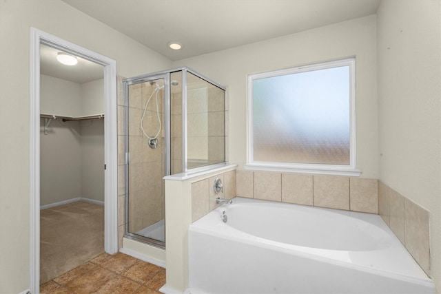 11410 Dahlia Dale Dr, Tomball, TX 77375 - full bath featuring a bath, a shower stall, a walk in closet, and tile patterned floors