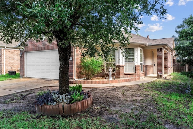 11410 Dahlia Dale Dr, Tomball, TX 77375 - view of front of house with brick siding, concrete driveway, and a garage
