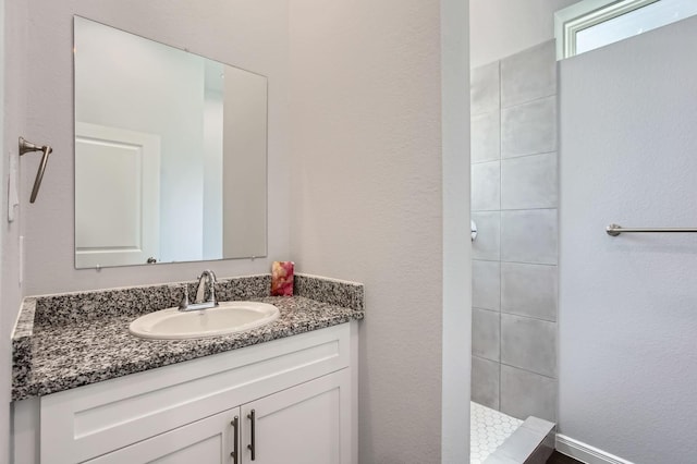 18823 Luminescent Ln, Spring, TX 77379 - full bathroom featuring vanity and a tile shower