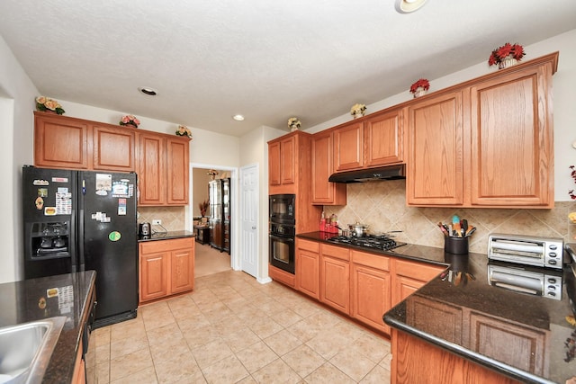 6723 Stableton Ln, Houston, TX 77049 - kitchen featuring black appliances, under cabinet range hood, backsplash, light tile patterned floors, and recessed lighting