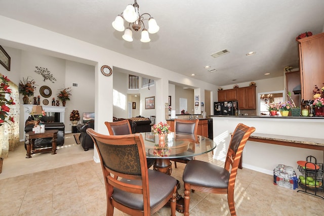 6723 Stableton Ln, Houston, TX 77049 - dining area featuring a chandelier, light tile patterned floors, and recessed lighting