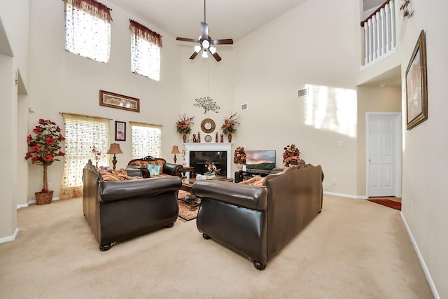 6723 Stableton Ln, Houston, TX 77049 - living area featuring a high ceiling, light colored carpet, baseboards, and ceiling fan
