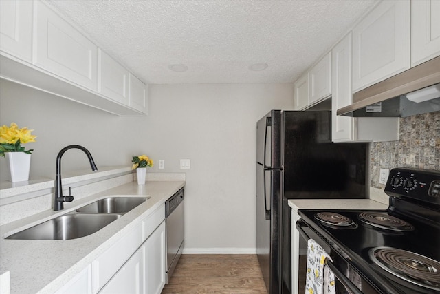 3754 Tanglewilde St N Unit C3, Houston, TX 77063 - kitchen with black electric range, a sink, under cabinet range hood, stainless steel dishwasher, and wood finished floors