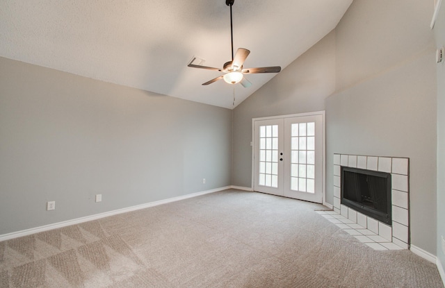 13215 Bunker Hill Dr, Willis, TX 77318 - unfurnished living room featuring light colored carpet, a ceiling fan, high vaulted ceiling, baseboards, and french doors