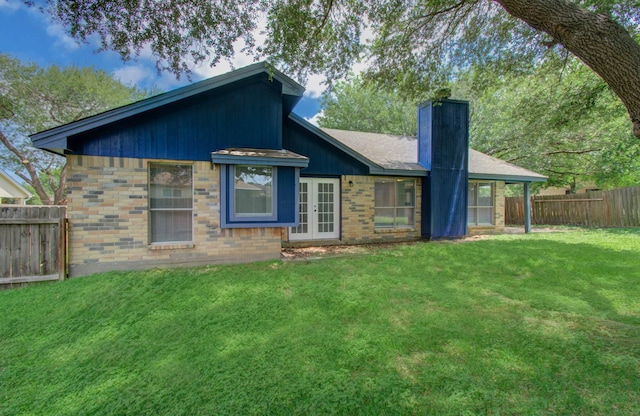13215 Bunker Hill Dr, Willis, TX 77318 - rear view of property featuring a chimney, french doors, and brick siding