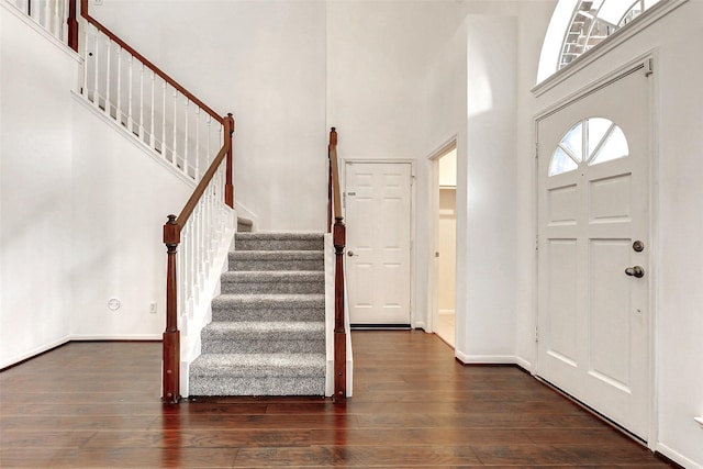 17935 Western Pass Ln, Houston, TX 77095 - entrance foyer with a high ceiling, wood-type flooring, stairs, and baseboards