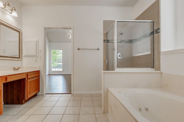 17935 Western Pass Ln, Houston, TX 77095 - full bathroom with vanity, a whirlpool tub, a shower stall, and tile patterned floors