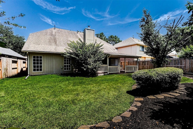 17935 Western Pass Ln, Houston, TX 77095 - rear view of house with a chimney and a shingled roof