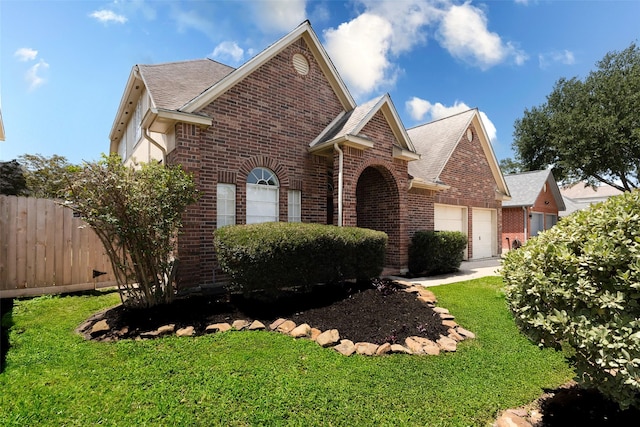 17935 Western Pass Ln, Houston, TX 77095 - view of front of house featuring brick siding, a garage, and a shingled roof