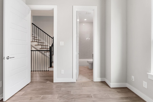 2653 Fountain Key Blvd, Houston, TX 77008 - unfurnished room featuring baseboards, light wood-style flooring, and stairway