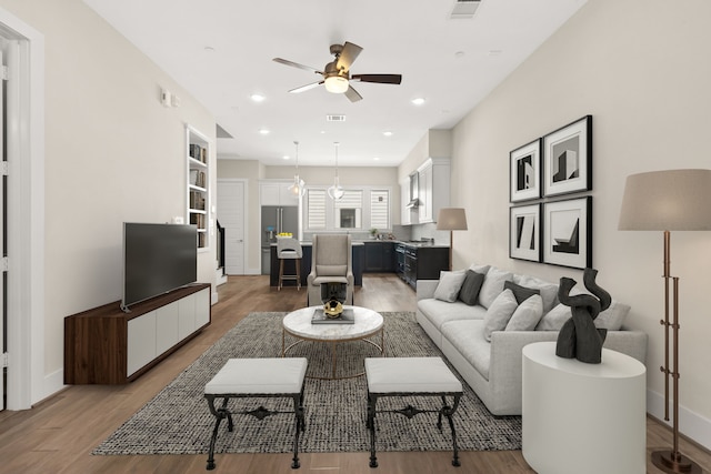 2653 Fountain Key Blvd, Houston, TX 77008 - living room featuring a ceiling fan, light wood-style flooring, recessed lighting, and baseboards