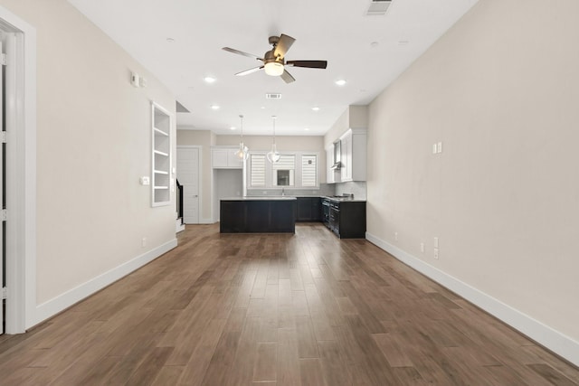 2653 Fountain Key Blvd, Houston, TX 77008 - unfurnished living room with a ceiling fan, wood finished floors, baseboards, and recessed lighting