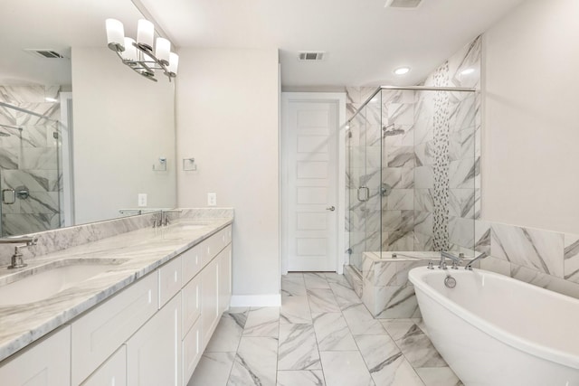 2653 Fountain Key Blvd, Houston, TX 77008 - full bathroom with marble look tile flooring, a freestanding bath, a stall shower, double vanity, and recessed lighting