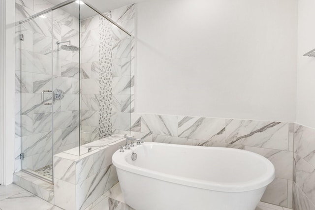 2653 Fountain Key Blvd, Houston, TX 77008 - full bathroom with a soaking tub, marble finish flooring, tile walls, and a stall shower