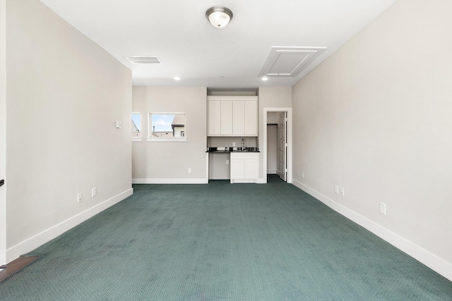 2653 Fountain Key Blvd, Houston, TX 77008 - unfurnished living room with baseboards, attic access, and dark colored carpet