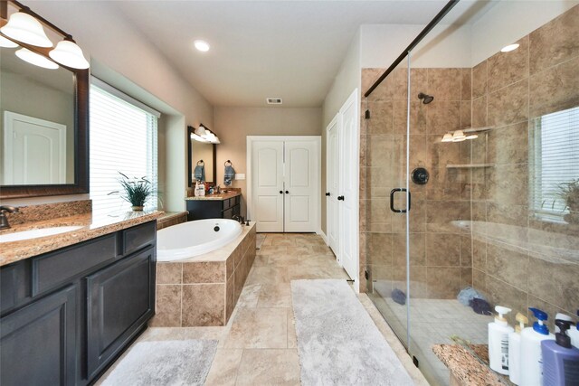 31602 Hummingbird Oak Dr, Hockley, TX 77447 - bathroom with a stall shower, two vanities, and a bath