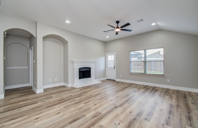 4506 Knights Ct, Baytown, TX 77521 - unfurnished living room with ceiling fan, recessed lighting, light wood-style floors, a fireplace with raised hearth, and baseboards