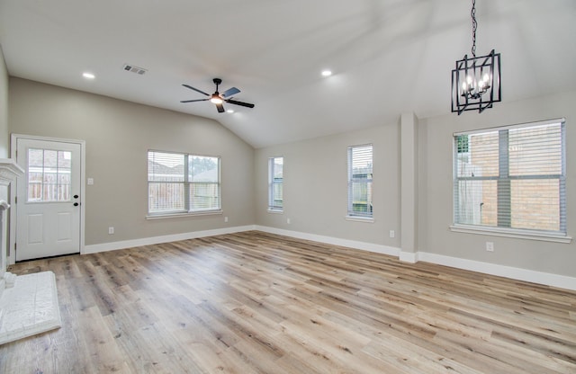 4506 Knights Ct, Baytown, TX 77521 - unfurnished living room featuring a chandelier, vaulted ceiling, plenty of natural light, light wood-style flooring, and recessed lighting