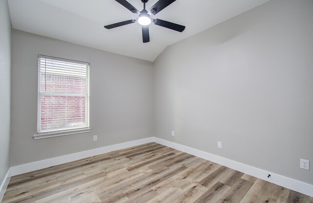 4506 Knights Ct, Baytown, TX 77521 - spare room featuring plenty of natural light, ceiling fan, baseboards, and vaulted ceiling