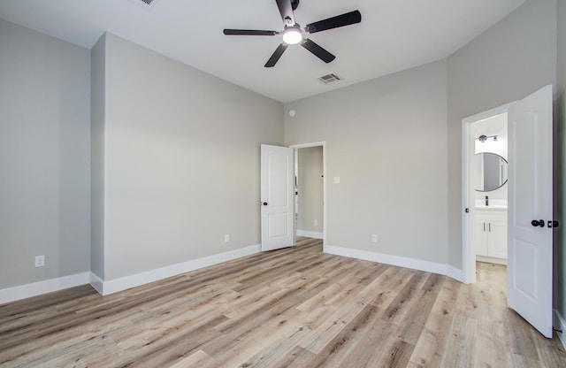 4506 Knights Ct, Baytown, TX 77521 - unfurnished bedroom with light wood finished floors, connected bathroom, baseboards, and a ceiling fan